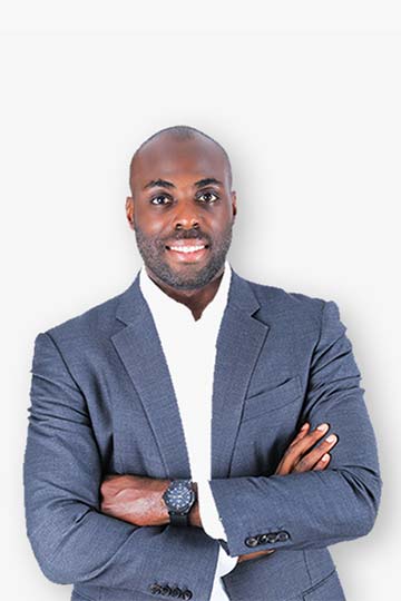 A well-dressed black man in a suit and tie, exuding confidence and professionalism.